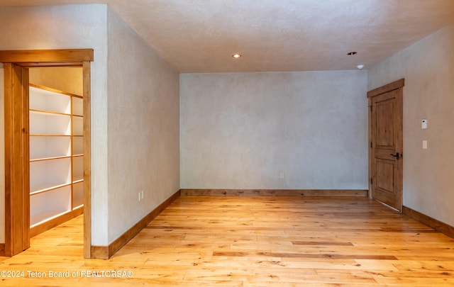 spare room featuring light hardwood / wood-style flooring