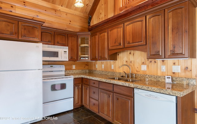 kitchen featuring sink, wooden ceiling, light stone counters, white appliances, and wooden walls