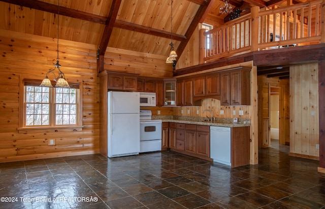 kitchen featuring light stone countertops, white appliances, high vaulted ceiling, a chandelier, and hanging light fixtures