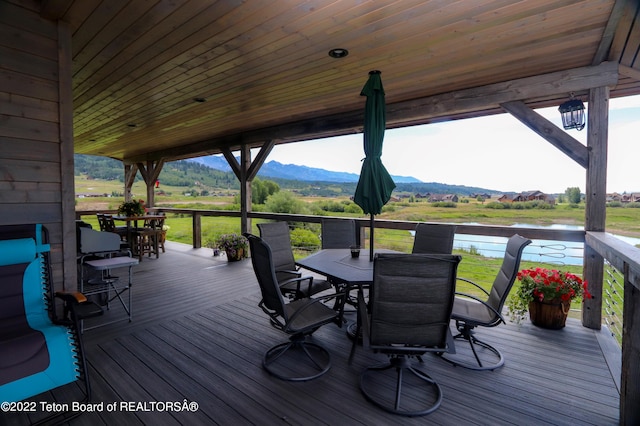 wooden terrace featuring a mountain view