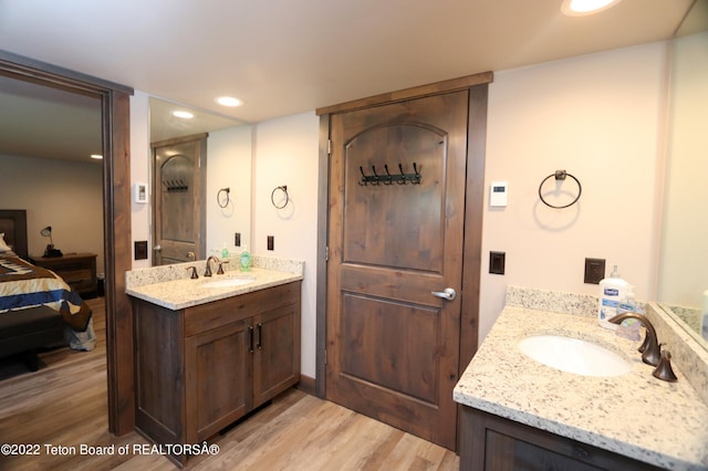 bathroom featuring vanity and hardwood / wood-style floors