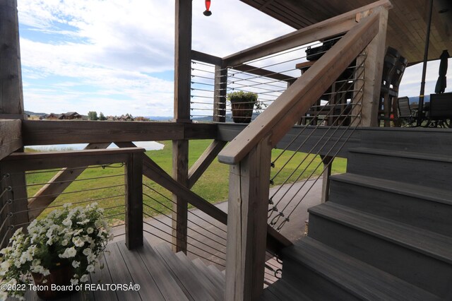 wooden terrace with a yard