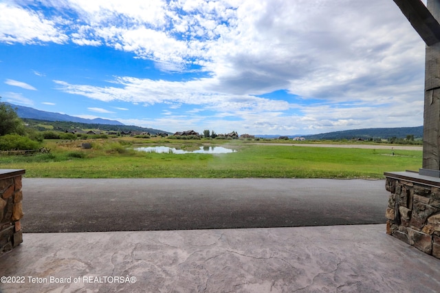 exterior space featuring a water and mountain view