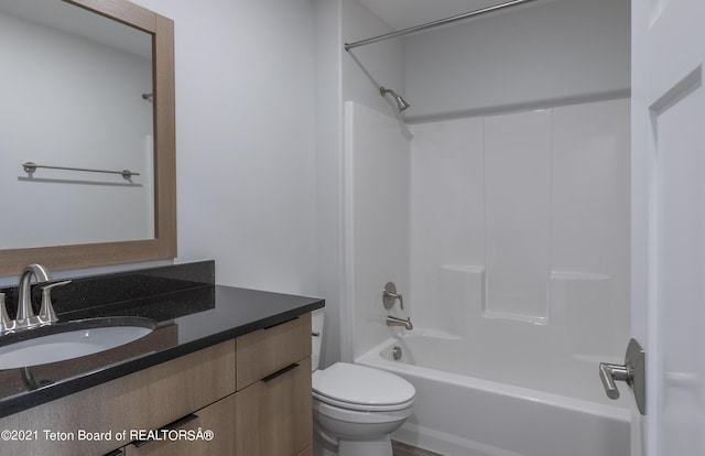 full bathroom featuring vanity, bathtub / shower combination, and toilet