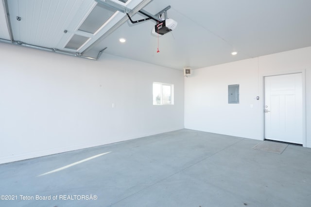 garage featuring a garage door opener and electric panel