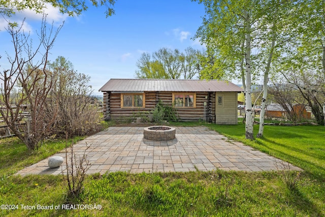 view of patio / terrace with an outdoor fire pit