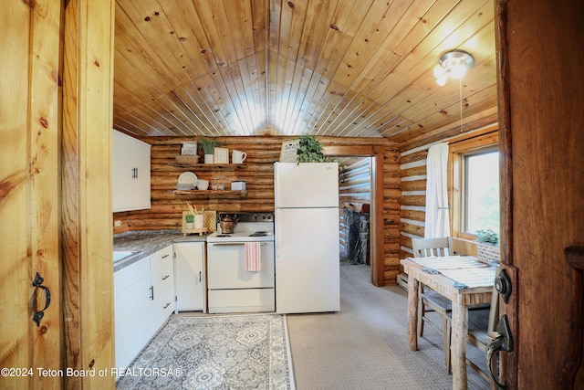 kitchen with rustic walls, white cabinetry, white refrigerator, wood ceiling, and range