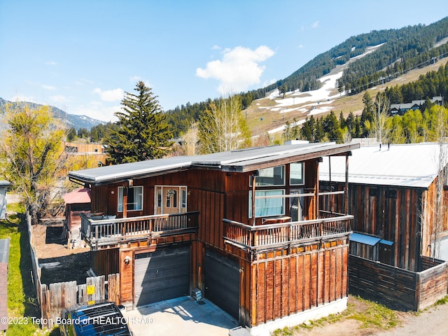 view of front of house with a mountain view and a garage