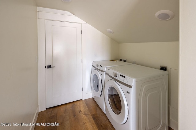 laundry area featuring washing machine and clothes dryer, dark hardwood / wood-style floors, washer hookup, and hookup for an electric dryer