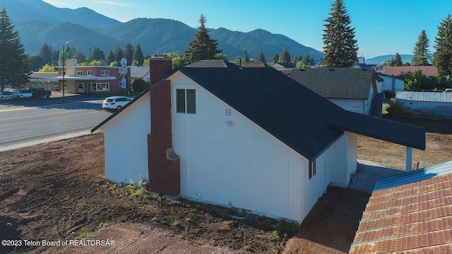 view of side of property with a mountain view