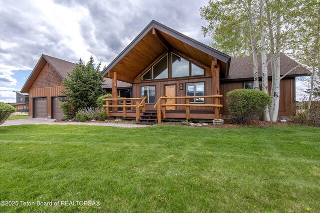 1515 Table Rock Dr, Driggs, ID 83422 - view of front of home featuring a shingled roof, a front lawn, a deck, and board and batten siding