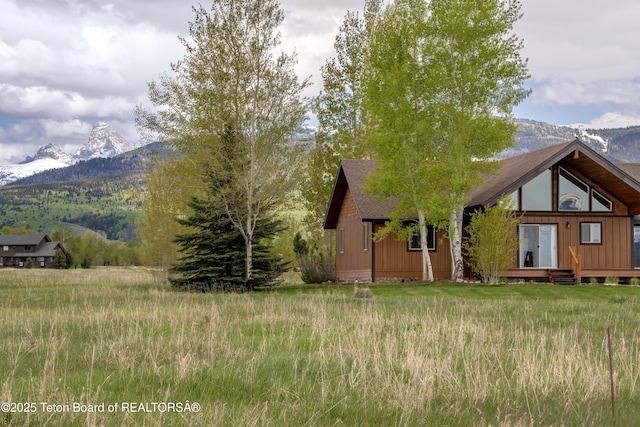1515 Table Rock Dr, Driggs, ID 83422 - view of front of home featuring a mountain view and roof with shingles