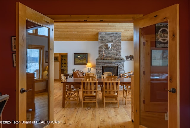 1515 Table Rock Dr, Driggs, ID 83422 - dining room with light wood-type flooring and a fireplace