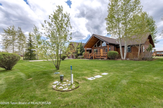 1515 Table Rock Dr, Driggs, ID 83422 - view of grassy yard with a wooden deck