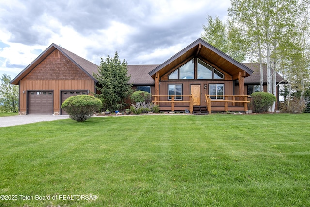 1515 Table Rock Dr, Driggs, ID 83422 - rustic home with driveway, roof with shingles, a front lawn, board and batten siding, and a garage