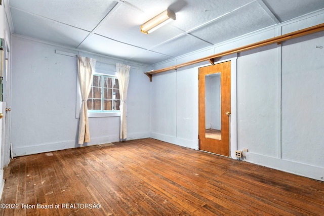 basement featuring dark hardwood / wood-style flooring