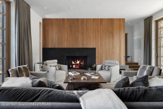 living room with wood walls