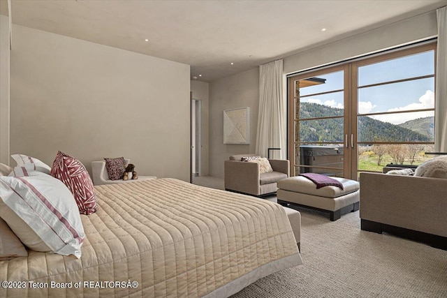 carpeted bedroom with a mountain view