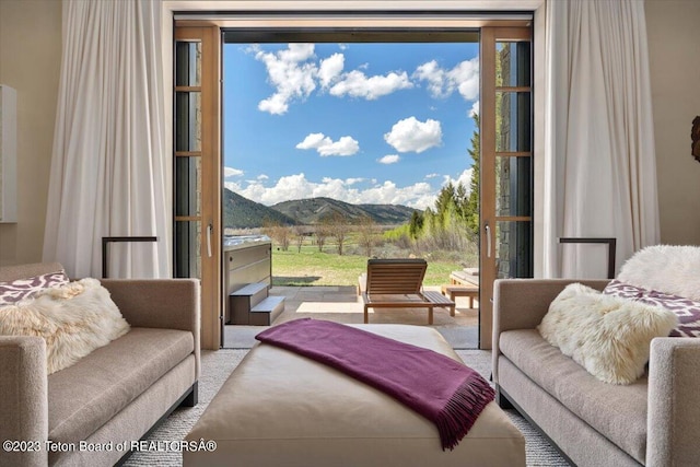 carpeted living room with a mountain view