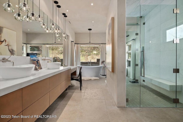 bathroom with shower with separate bathtub, tile flooring, and double vanity