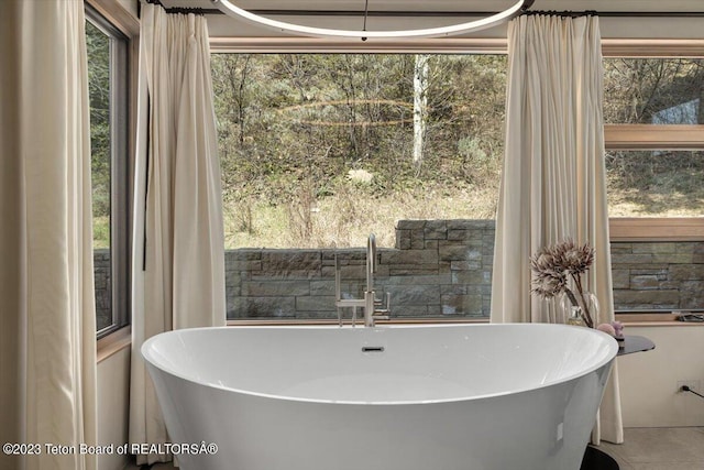 bathroom with sink, tile floors, and plenty of natural light