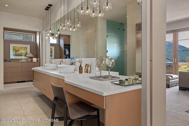 bathroom featuring an inviting chandelier, tile flooring, vanity, and french doors