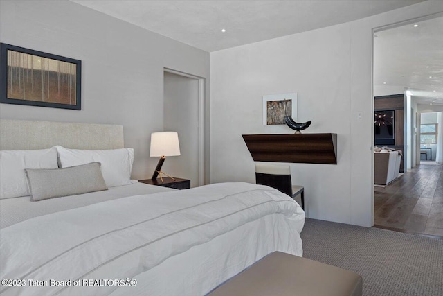 bedroom featuring dark hardwood / wood-style floors