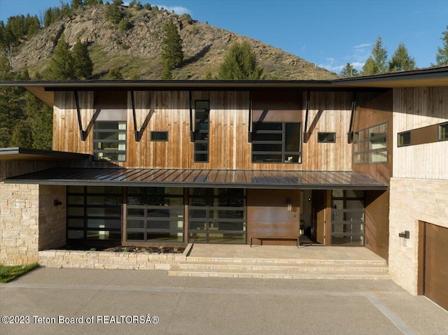 view of front facade featuring a mountain view