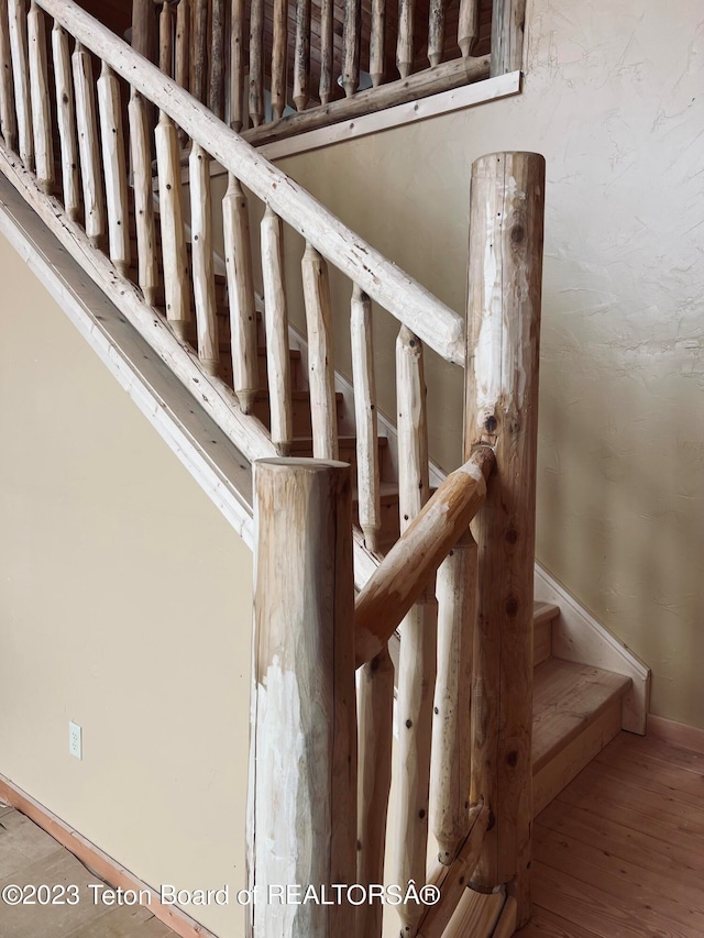 staircase with light wood-type flooring