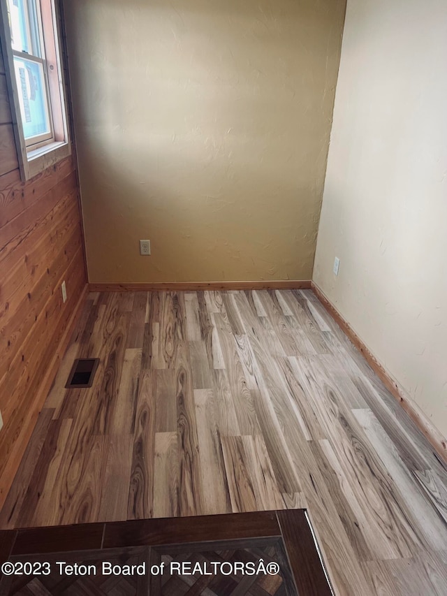 empty room with light wood-type flooring