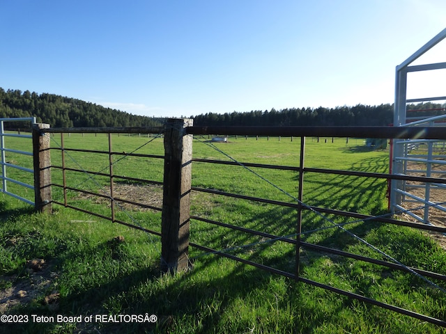 view of gate featuring a rural view