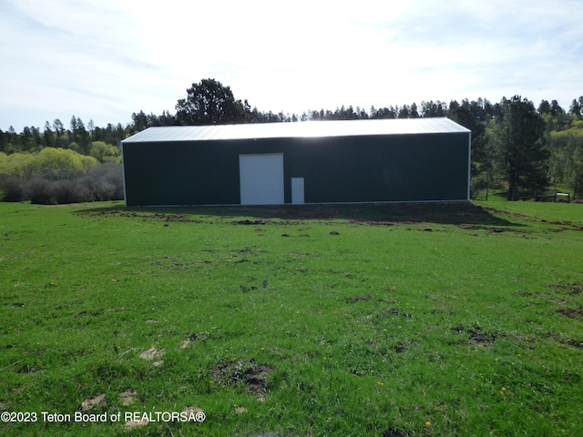 exterior space with a front yard and an outdoor structure