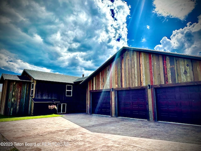 view of side of property with a garage