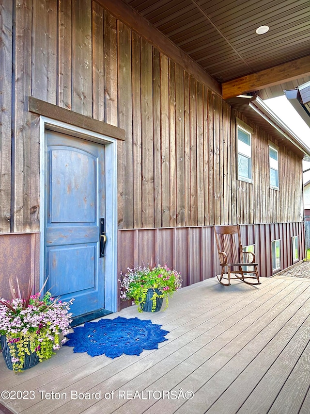 doorway to property featuring a wooden deck