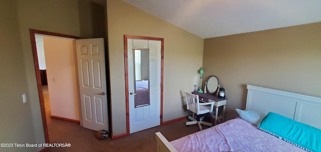 carpeted bedroom featuring vaulted ceiling