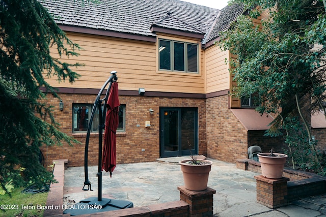 rear view of house with a patio