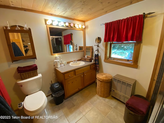 bathroom featuring wood ceiling, tile patterned floors, toilet, vanity, and heating unit