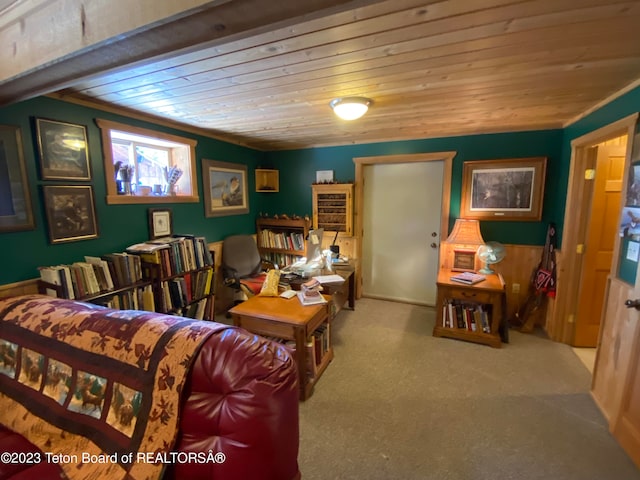 carpeted living room with wood ceiling