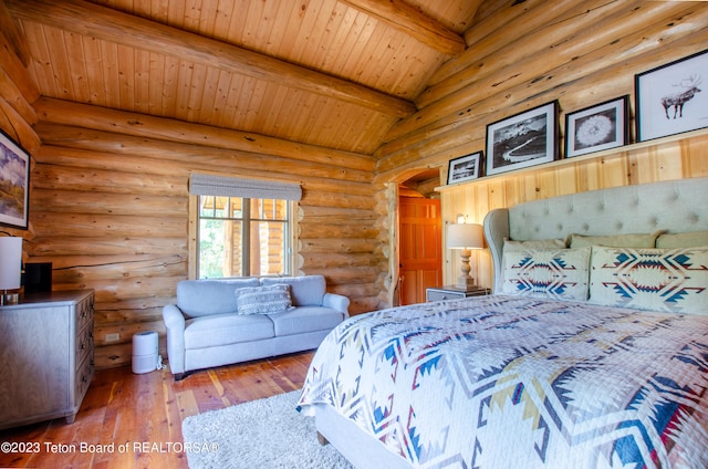 bedroom featuring lofted ceiling with beams, dark wood-type flooring, wood ceiling, and rustic walls