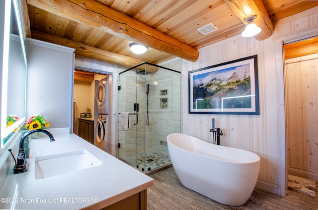 bathroom featuring stacked washer and dryer, wood ceiling, beamed ceiling, vanity, and hardwood / wood-style flooring