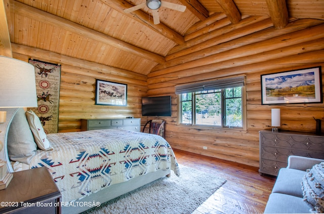 bedroom with lofted ceiling with beams, hardwood / wood-style floors, wooden ceiling, and rustic walls