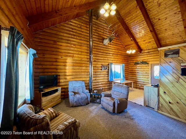 unfurnished living room featuring wood ceiling, a chandelier, log walls, and high vaulted ceiling