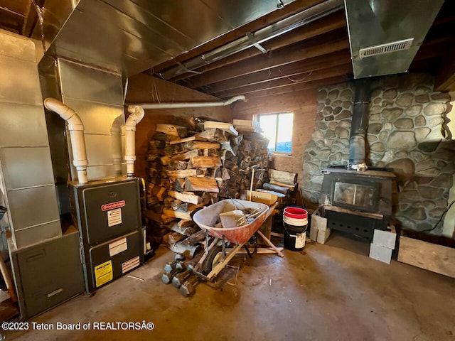 basement featuring a wood stove