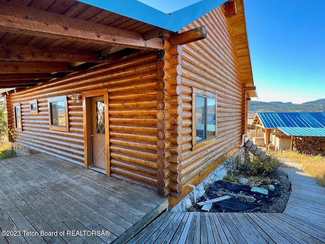 wooden deck featuring a mountain view