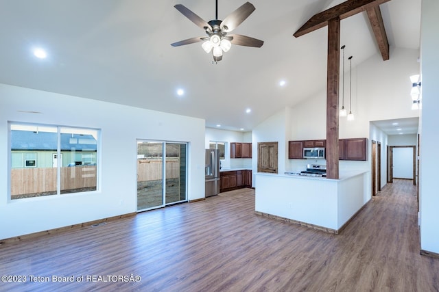 kitchen featuring wood-type flooring, stainless steel appliances, beamed ceiling, and ceiling fan