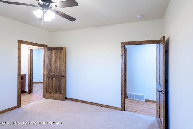 unfurnished bedroom with ceiling fan and light hardwood / wood-style floors