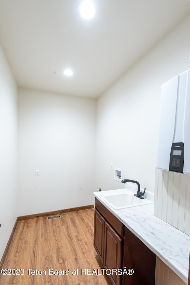 bathroom featuring hardwood / wood-style flooring and sink