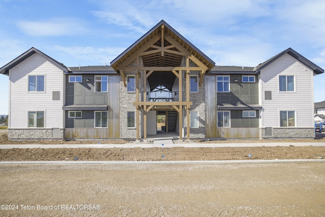 view of front of home with a balcony