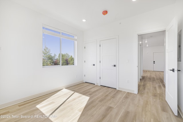 unfurnished bedroom with light hardwood / wood-style floors