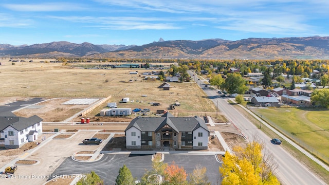 birds eye view of property featuring a mountain view